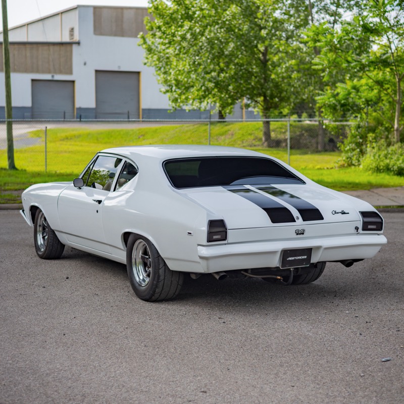 White Twin Turbo Chevelle with black stripes, front three-quarter view